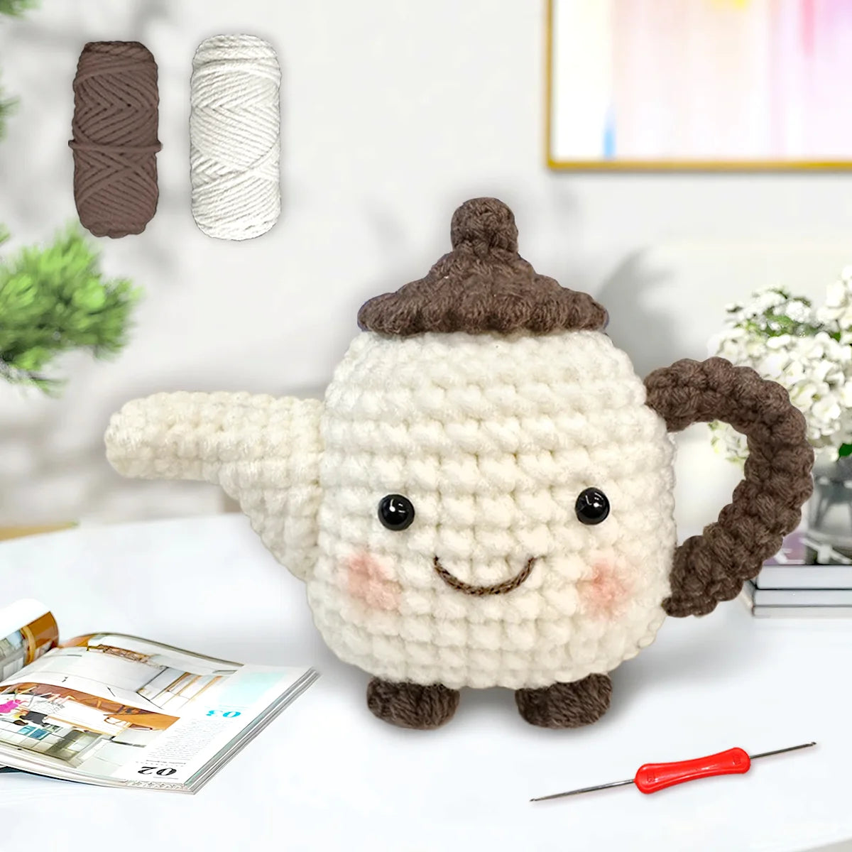 A finished crocheted amigurumi animal in cream and brown yarn, displayed on a white surface with crochet tools.