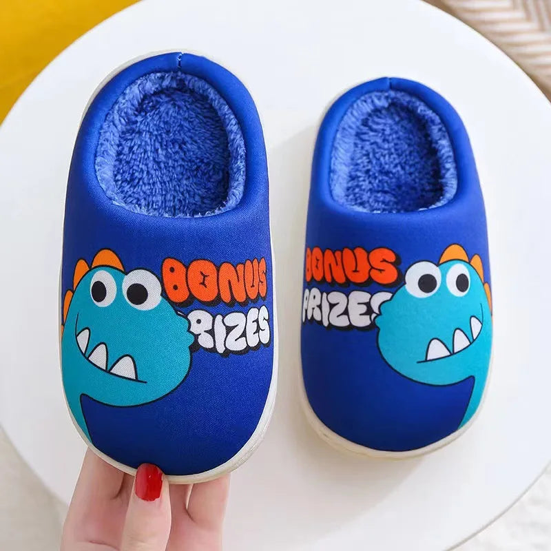 Pair of blue dinosaur plush slippers with fuzzy lining resting on a white plate.