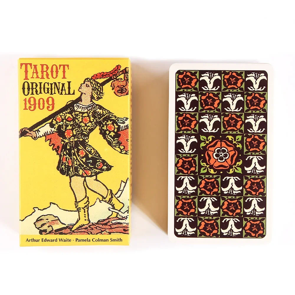 A yellow box for the Tarot Original 1909 deck with a black and white card featuring ornate symbols.