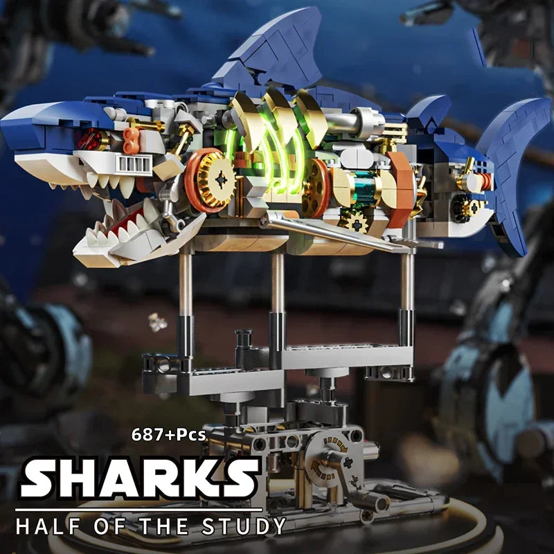A detailed mechanical shark model built from plastic parts displayed on a stand.