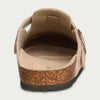 A view of a tan suede cork mule showing the interior lining and the cork foot.