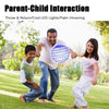 A father and daughter are playing with a 360° rotating LED flying ball, a hand-controlled floating toy for kids, outdoors.