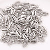 A collection of 50 small silver plastic seashell charms for jewelry making, featuring bohemian cowrie and conch pendants.