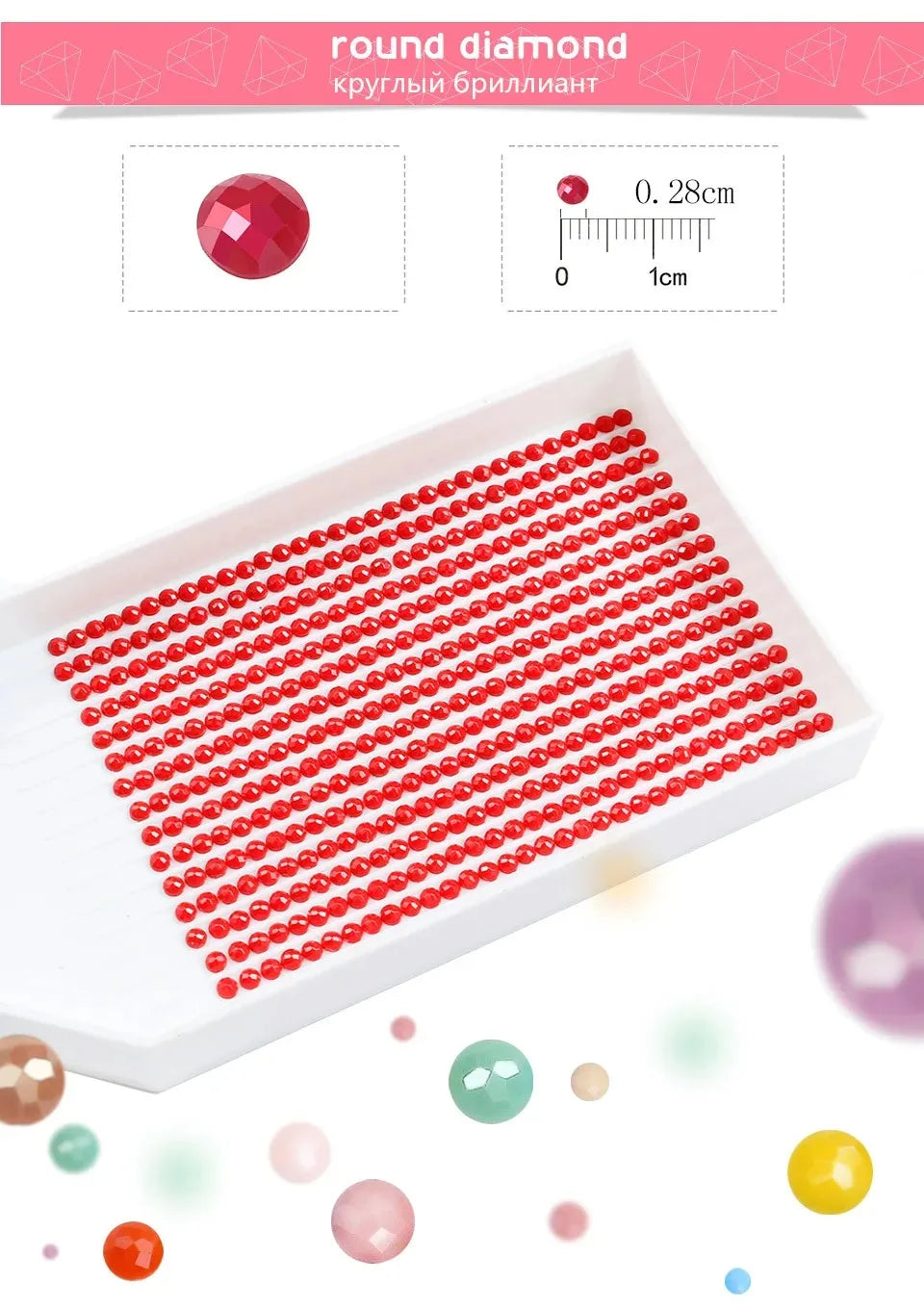 A white tray filled with numerous red round diamonds arranged in rows, demonstrating the size of the stones.