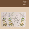 A white journal cover titled My Pregnancy Journal featuring floral designs and a silhouette of a pregnant woman.