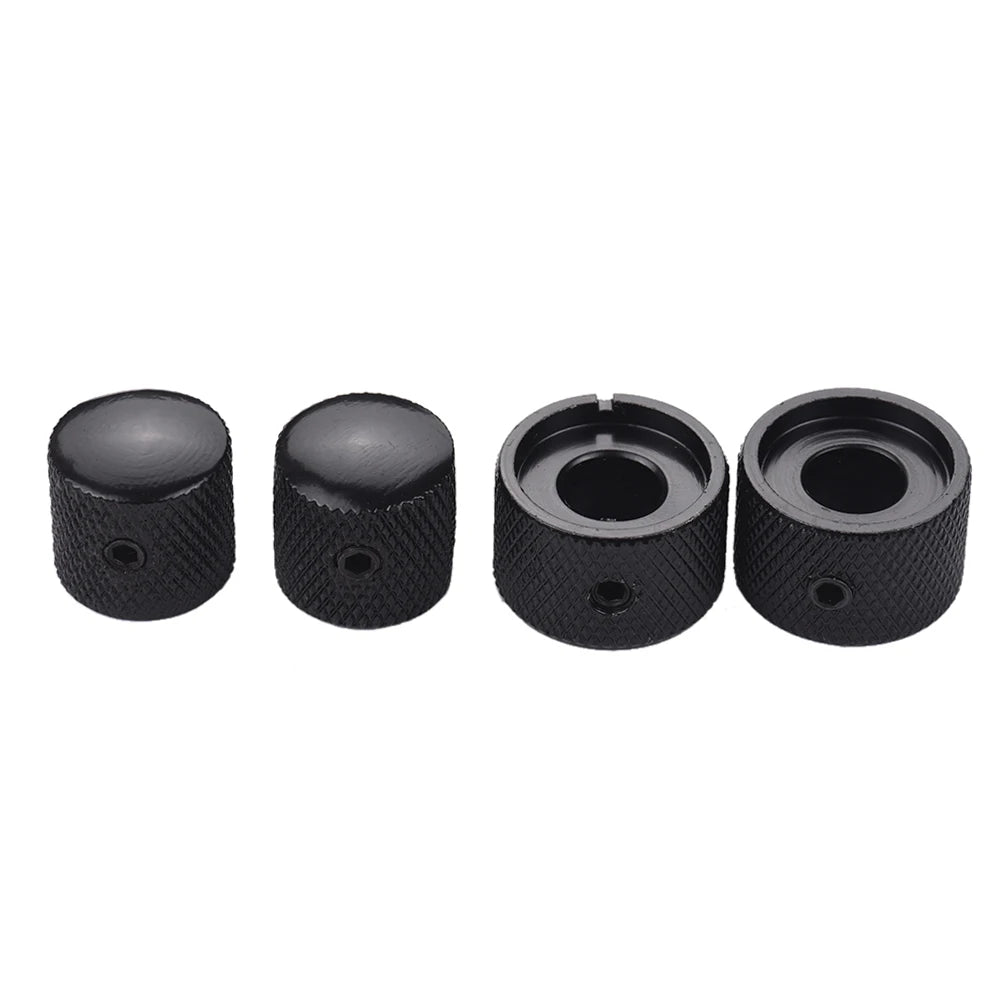 A set of two black dual concentric stacked control knobs for electric guitar and bass.