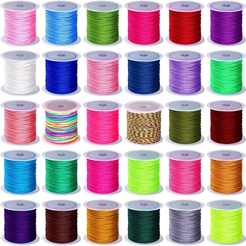 Spool of 50 yards of 0.8mm nylon knotting cord in various colors including pink, blue, green, red, and purple.