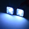 A pair of bright blue LED warning lights mounted on a black base, illuminating the surface below.