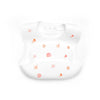 A white silicone baby bib with an adjustable neck featuring small pink starfish and coral designs.