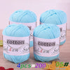 Four skeins of light blue cotton knitting yarn for crochet and handmade projects