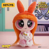 A collectible figure of Blossom from The Powerpuff Girls series with orange hair and pink outfit.