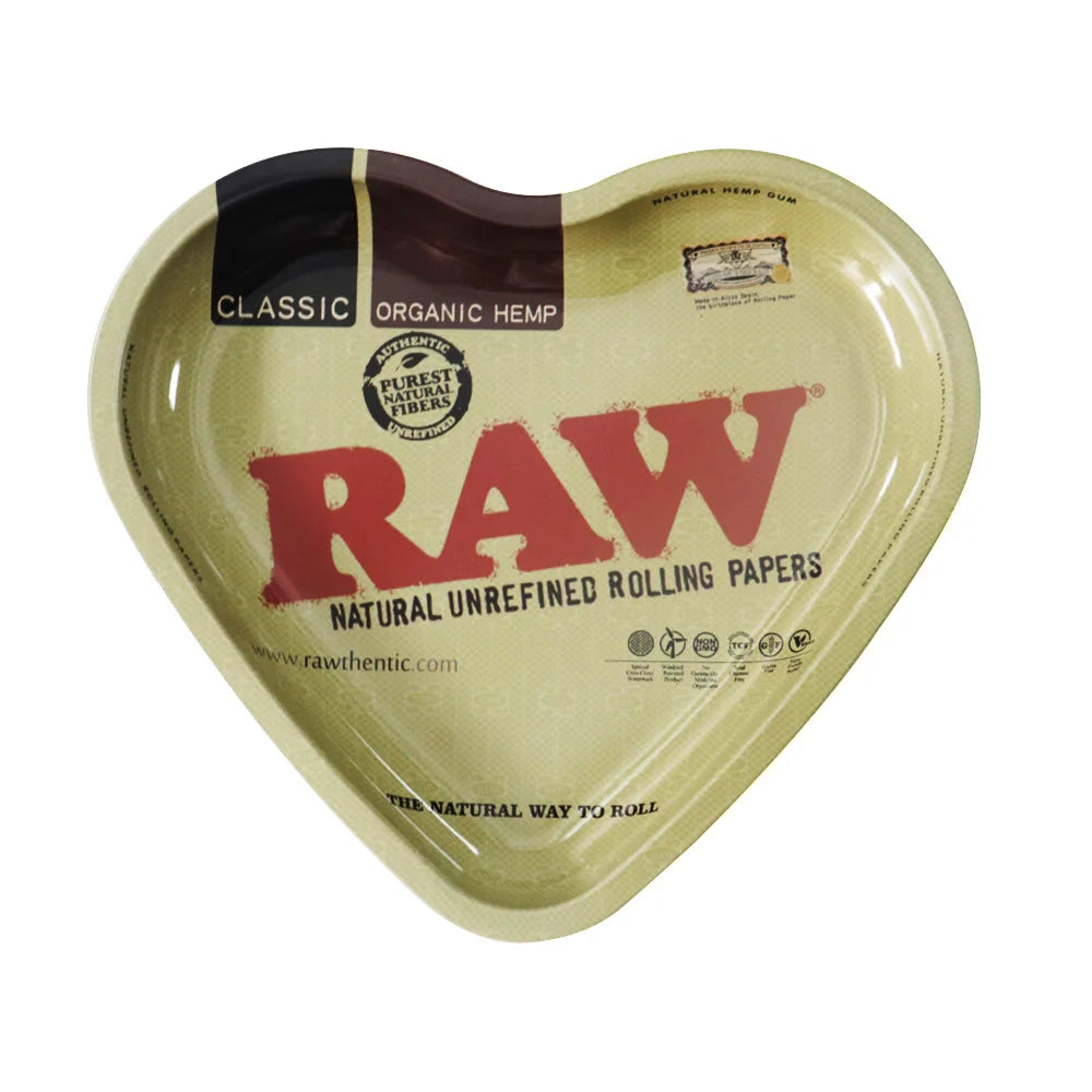 A heart-shaped organic hemp rolling tray labeled RAW natural unrefined rolling papers.
