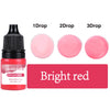 A bottle of bright red liquid candle dye with dropper tips showing 1, 2, and 3 drops.