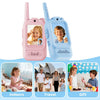 Two pink and blue kids video walkie-talkies with 2.0-inch screens shown in indoor, travel, and gift contexts.