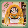 A plush blind box featuring a character in traditional attire with long yellow fur hood and purple hair.