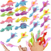 A collection of colorful rubber dinosaur slingshot toys in various shapes and colors