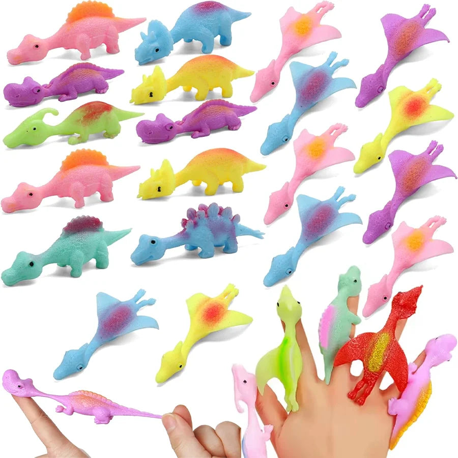 A collection of colorful rubber dinosaur slingshot toys in various shapes and colors