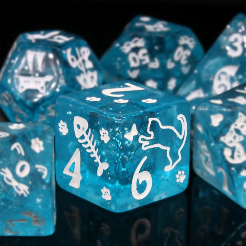 A close-up of a set of translucent blue polyhedral dice showing numbers 4 and 6.