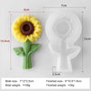 A silicone mold of a yellow sunflower flower and stem, shown next to its finished size.