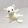 A white plush mouse with large eyes and a small gold crescent moon detail.