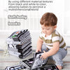 A baby is looking at a stack of black and white cloth books designed for multidimensional sensory cognition.