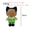 A plush doll resembling Eminem, XXXTentacion, and Frank Ocean, dressed in a green shirt.