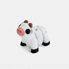 A white and brown cow figurine with black markings, showing a close-up view.