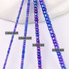 A close-up photo showing various sizes of purple and blue glass rice beads for jewelry making