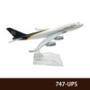 A diecast model of a UPS airplane in flight, featuring the UPS logo and text.
