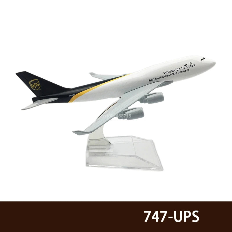 A diecast model of a UPS airplane in flight, featuring the UPS logo and text.