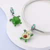 A set of fruit charm beads made of 925 sterling silver with zircon stones, featuring a green and yellow fruit design.