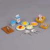 A set of 1:12 scale dollhouse furniture including kitchen, living room, and bedroom items