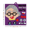 A purple felt puzzle game featuring a gray face with glasses and a smiling mouth, including various facial features like eyes