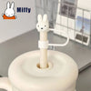 A white Miffy straw topper with a rabbit design is shown on a light gray surface.