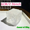 A clear, squishy block of coconut oil filling is shown on a white surface.