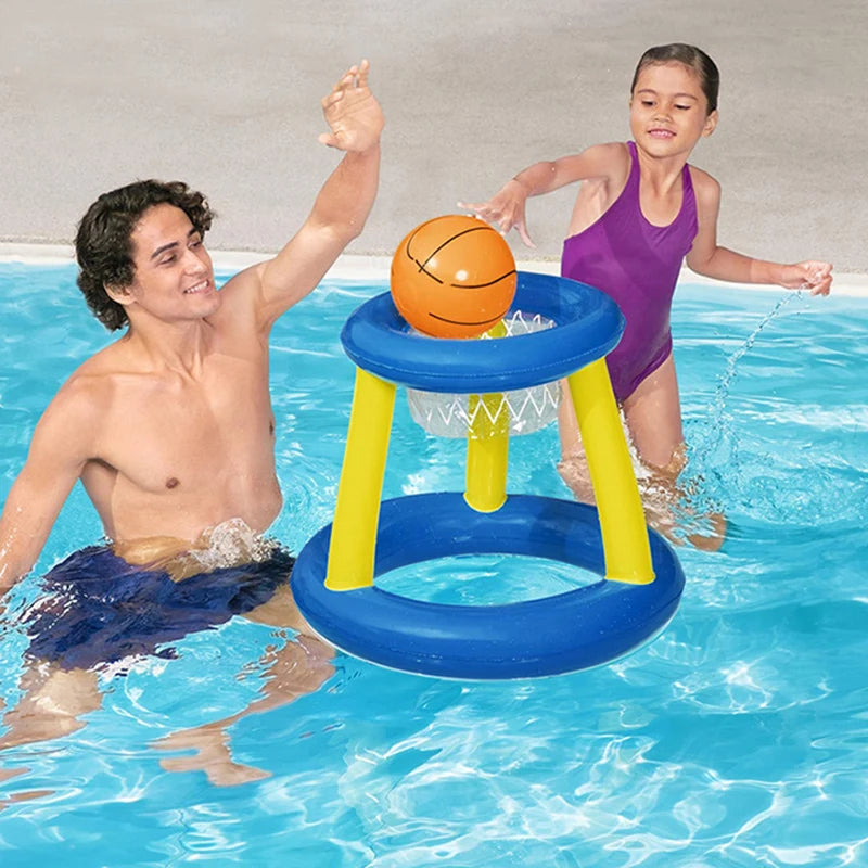 A boy and a girl play water volleyball using an inflatable ball and ring set in a swimming pool.
