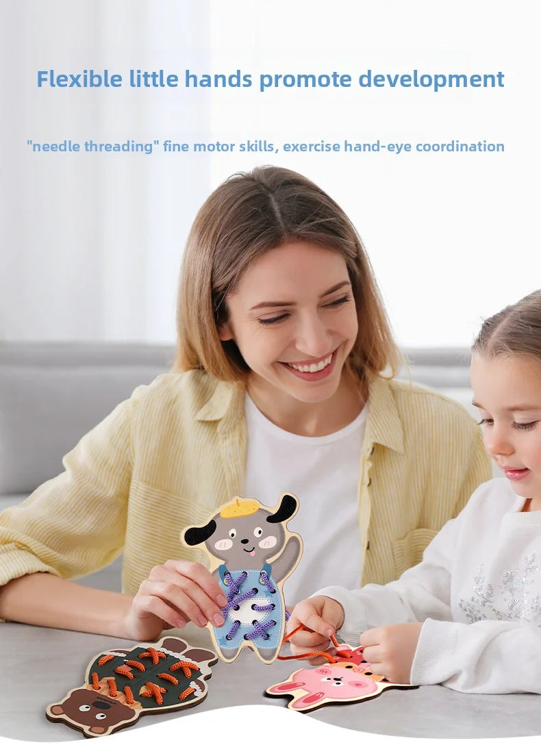 A woman is helping a child thread wooden beads onto a lacing toy for development.