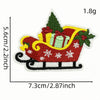 An embroidered iron-on patch depicting a festive sleigh loaded with gifts and decorated with Christmas greenery.