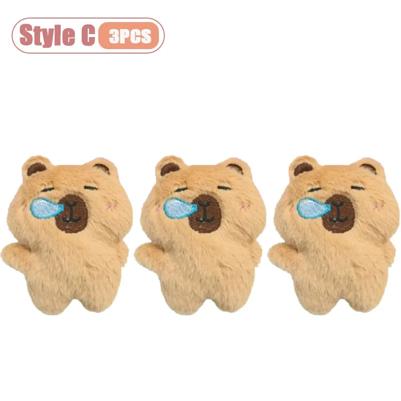 Three cute brown bear plush keychains with light blue squeakers