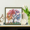 Diamond art painting kit featuring a colorful tree with pink, orange, and blue flowers on a canvas.