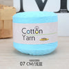 A ball of light blue 100% cotton yarn labeled as Cotton Yarn with a 100g weight.