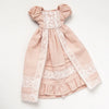 A vintage lace maid dress set for a doll featuring a pink bodice and skirt with delicate white lace trim.