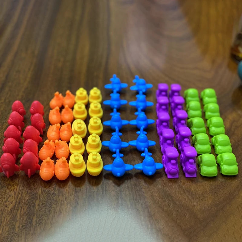 A set of colorful plastic animal sorting and counting toys arranged in rows by color.