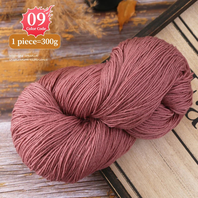 A ball of dusty rose colored premium alpaca blend yarn for knitting or crochet projects.