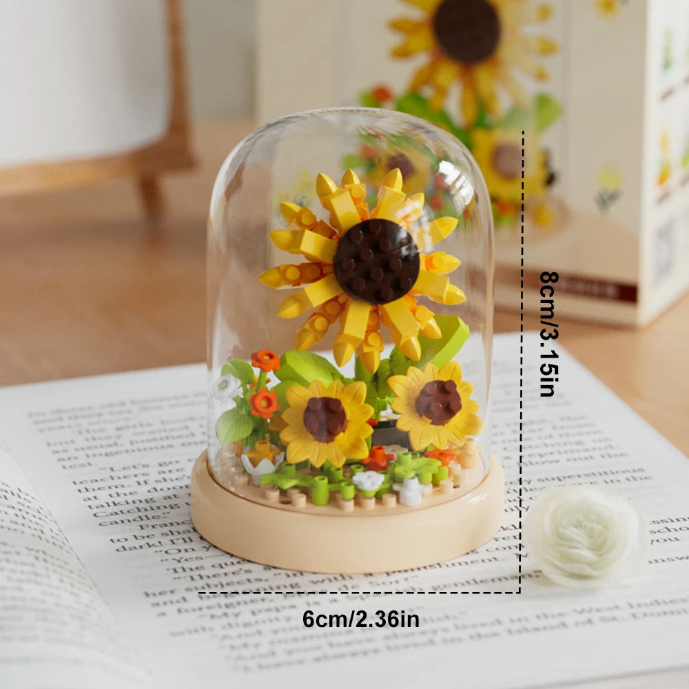 A clear glass dome display featuring a DIY flower bouquet built from colorful building blocks.