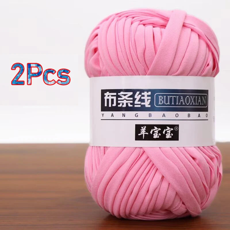 A skein of pink soft chunky t-shirt yarn for crochet and knitting, packaged as a 2-pack.