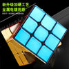 A close-up view of a blue magnetic 3x3 cube with gold accents, showing its facets and structure.