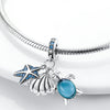 Sterling silver charm pendant set featuring a starfish, sea turtle, and whale shark against a white background