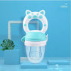 A white silicone baby food feeder with a teal lid and a teether attachment is displayed against a blue background.
