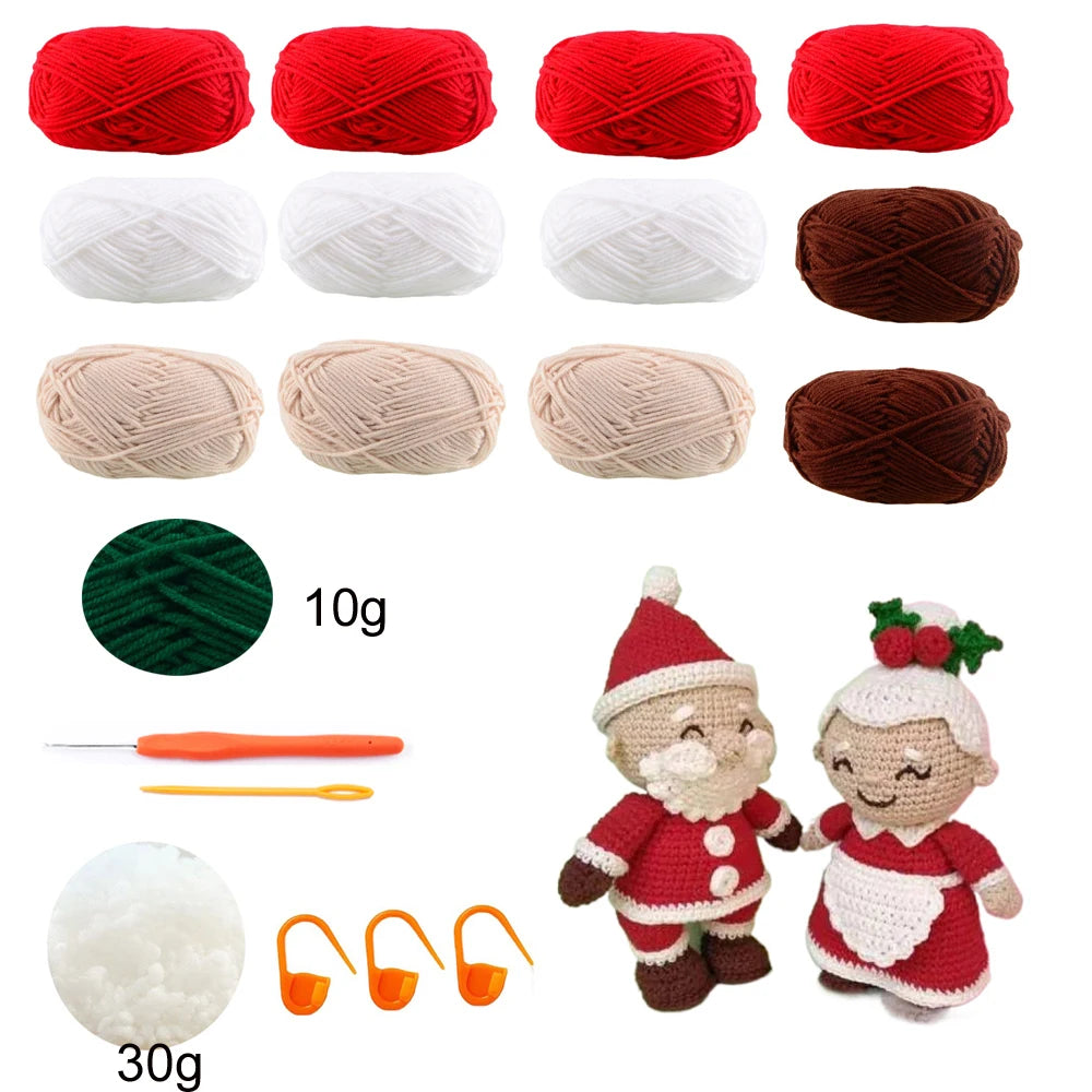 A collection of red, white, and brown yarn skeins, various weights, and a crocheted doll kit.
